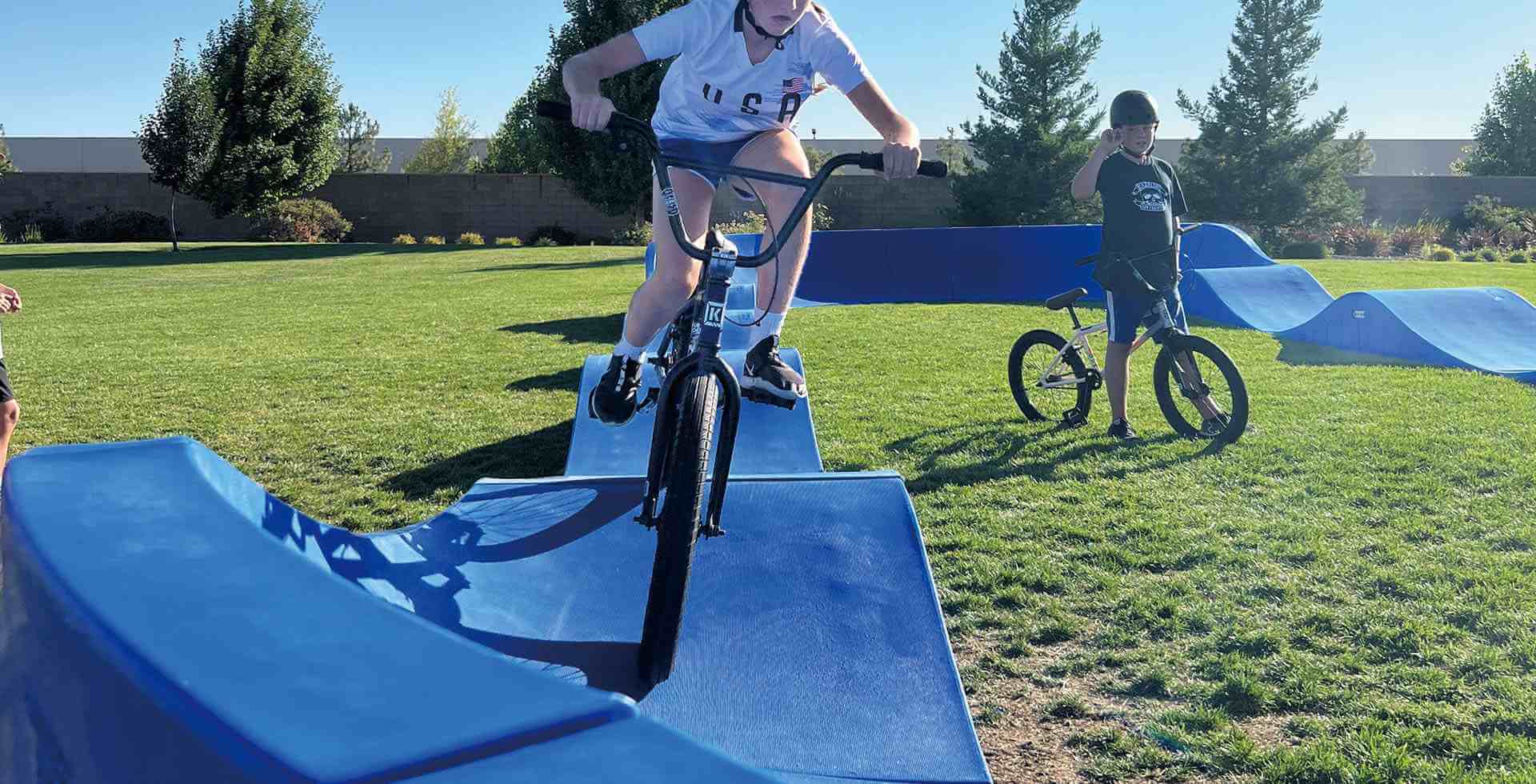 install a pump track on grass